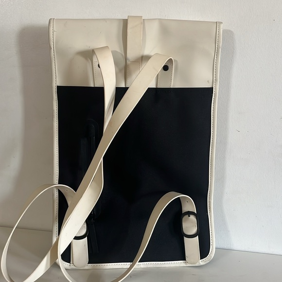 RAINS Shield Rucksack is a clean and functional backpack. Elegant Cream Backpack - Picture 9 of 11